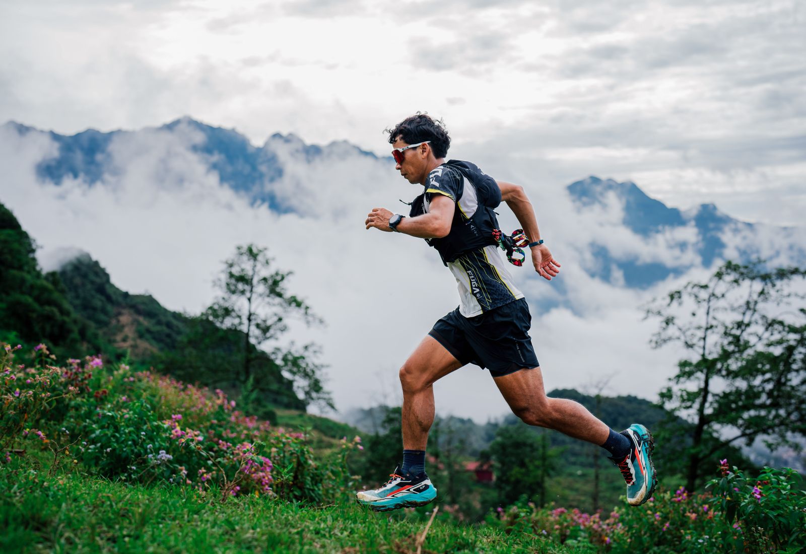 Trail runner on a ridge above the valley