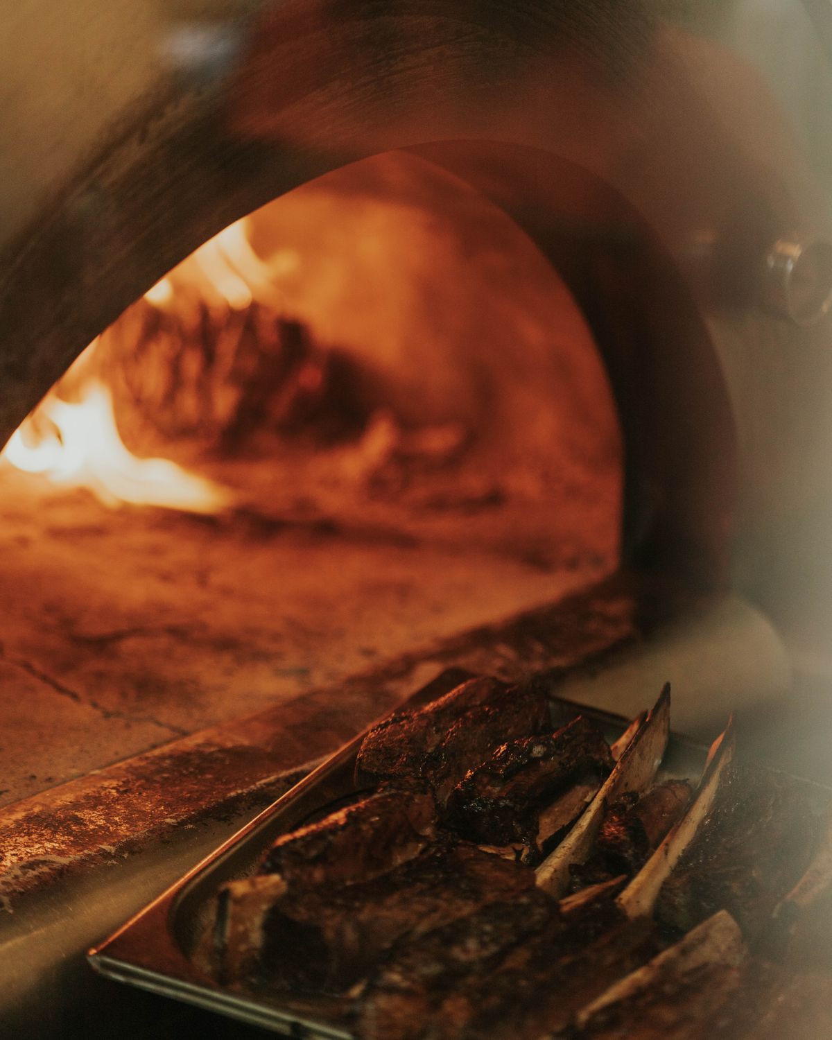 Larch embers inside the wood-fired oven