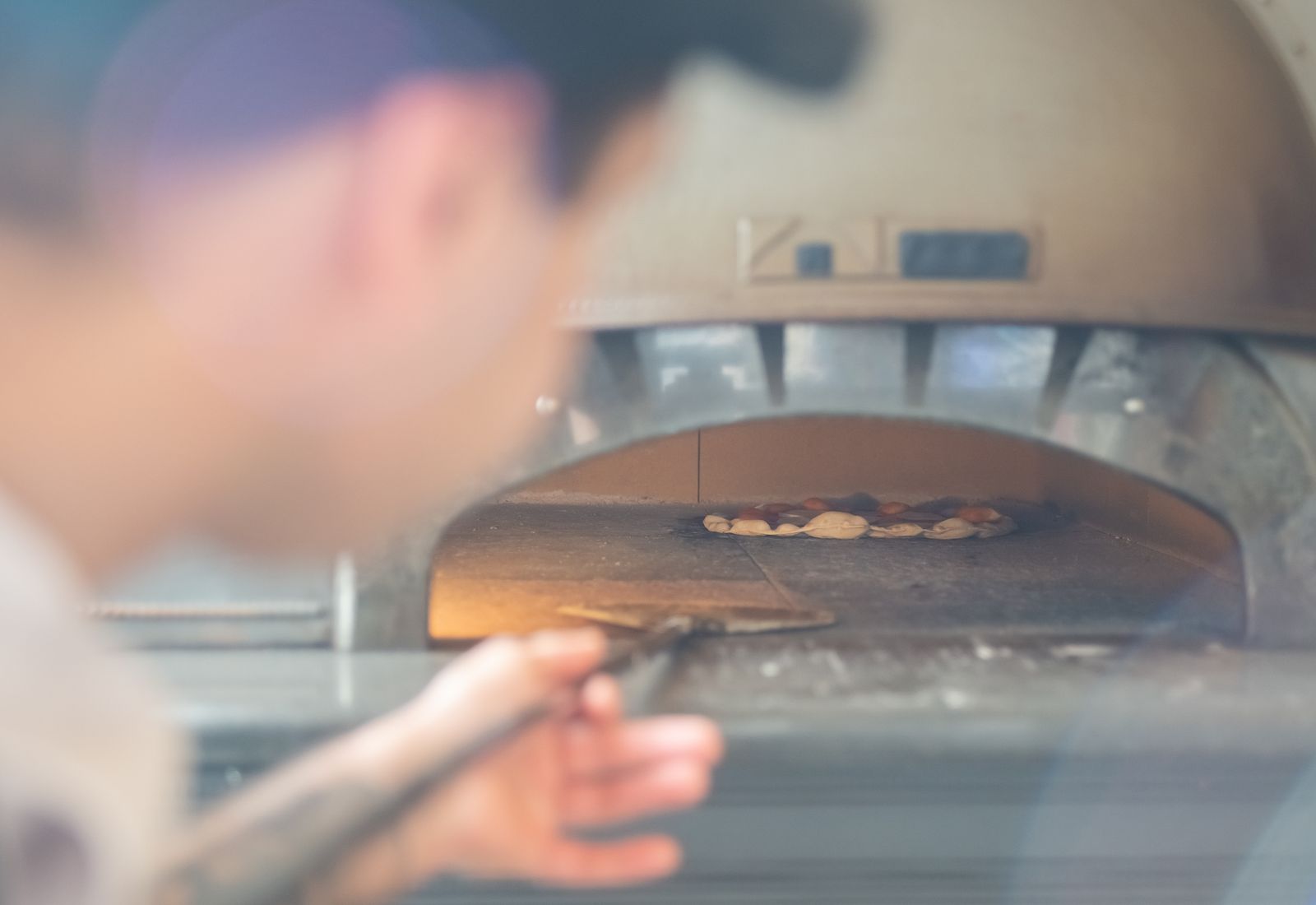 Chef at work beside the oven